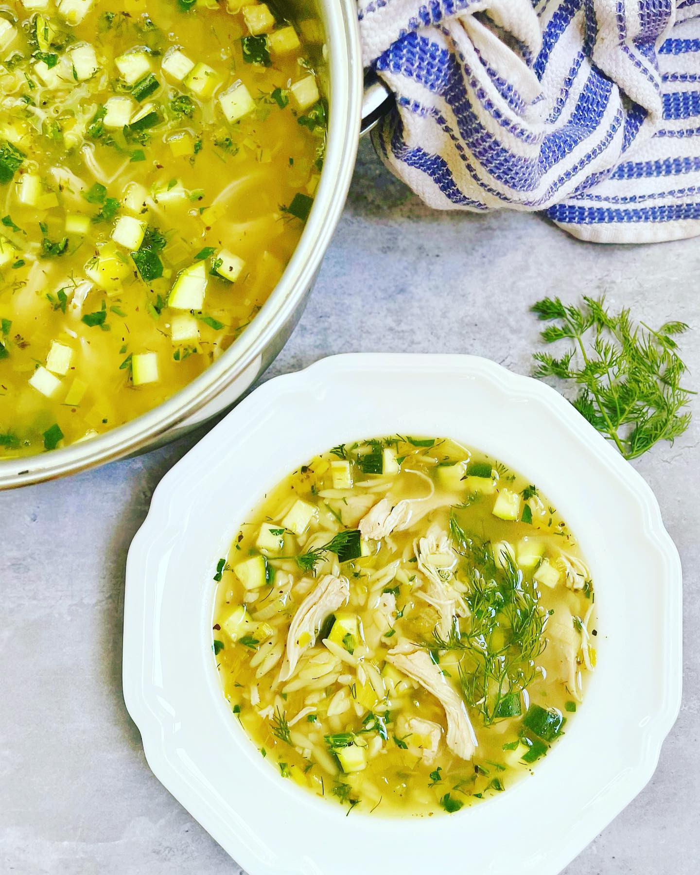 Lemony chicken and orzo soup - fresh citrus and herbs elevated this comforting soup and brightens it up on cold winter nights! Recipe @dinnerreinvented #orzo #pastarecipe #chickensoup #chickennoodlesoup #mediterraneandiet #mediterraneanfood #greekfood #dill #weeknightdinner #weeknightmeals #quickdinner #dinnerrecipes #dinnerideas #dinnerreinvented