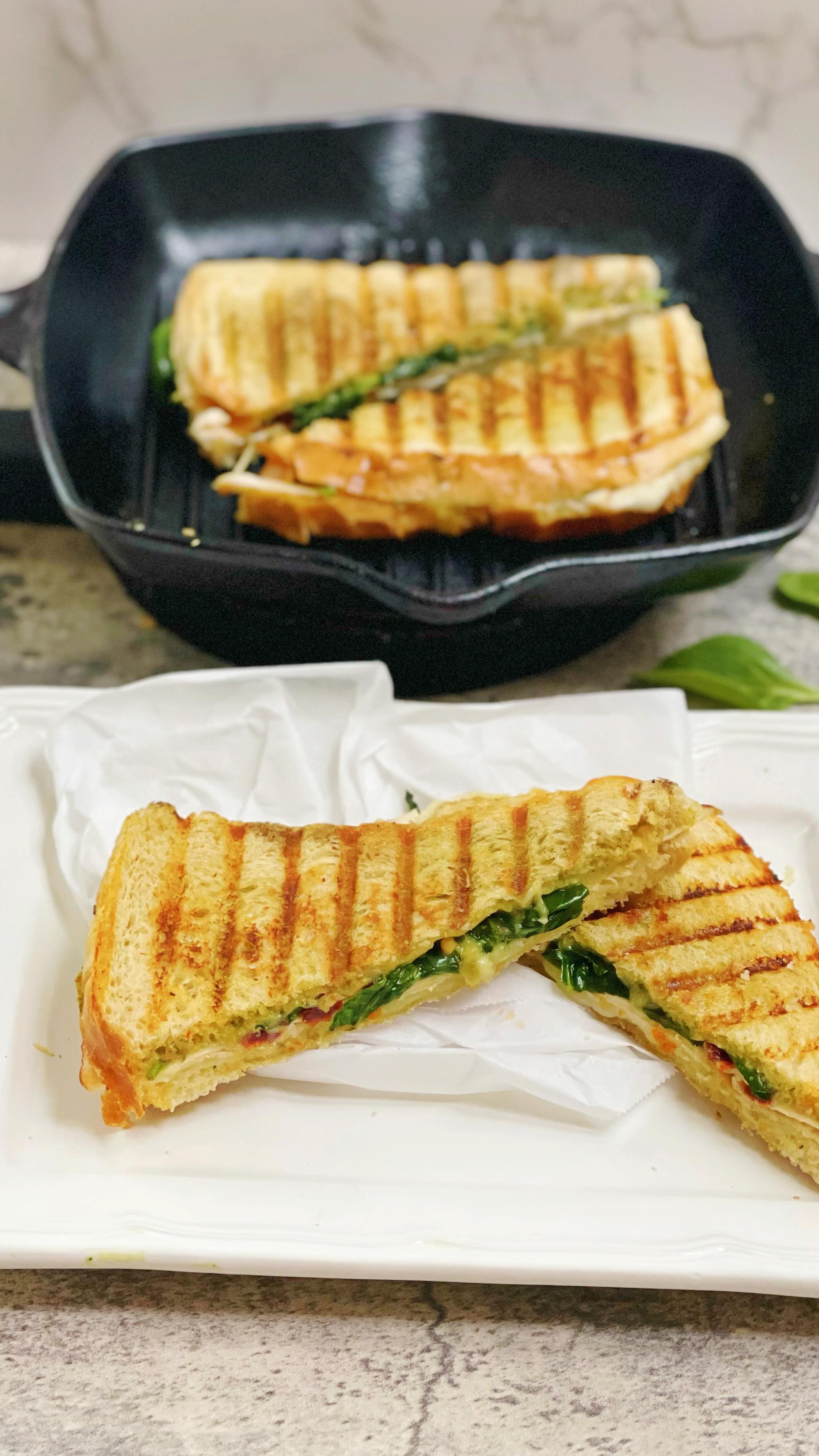 Chicken and Pesto Panini! Another @dinnerreinvented original recipe that is comfort food at its finest. Ingredients are below but  the best part is you can make this your own and add as much or as little as you want!

8 slices sourdough bread
16 thinly sliced provolone cheese
16 thinly sliced oven roasted chicken breast
1 cup basil pesto
1 cup mayonnaise
1 cup sun dried tomatoes, packed in oil
1/2 cup extra virgin olive oil
4 cups packed organic spinach
kosher salt to taste

#panini #pesto #chickenrecipes #sandwich #grilledcheese #grilledchicken #copycatrecipe #viralrecipes #viralreels #foodblogger #momblogger #kidsfood #comfortfood #castironcooking #dinnerreinvented